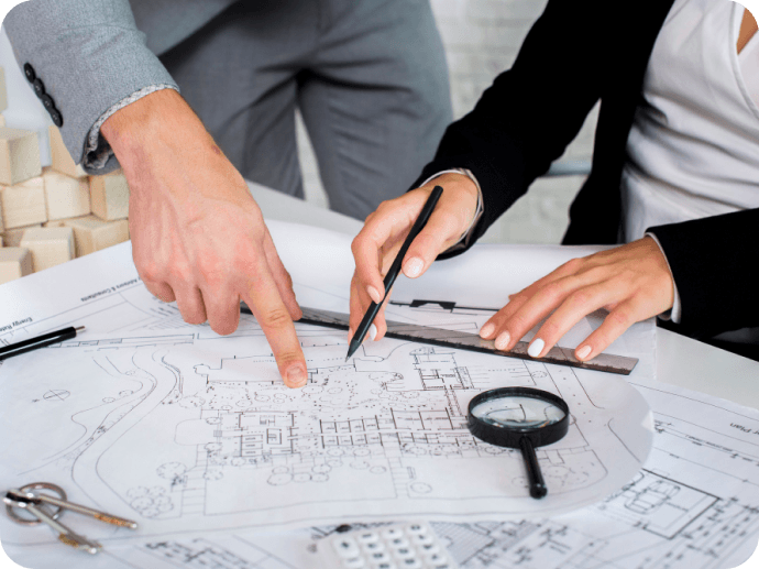 Engineers reviewing blueprints